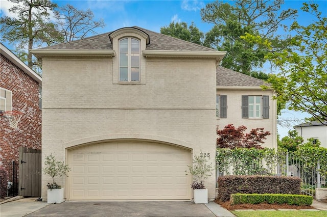 225 Ridgewood Dr, Metairie, LA 70005 - view of front of house with roof with shingles, asphalt driveway, and a garage