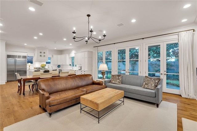 225 Ridgewood Dr, Metairie, LA 70005 - living room with ornamental molding, visible vents, light wood-type flooring, and recessed lighting