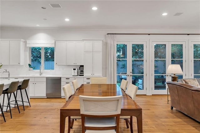 225 Ridgewood Dr, Metairie, LA 70005 - kitchen featuring stainless steel dishwasher, visible vents, white cabinetry, and crown molding