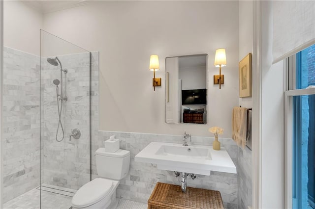225 Ridgewood Dr, Metairie, LA 70005 - bathroom featuring walk in shower, tile walls, crown molding, and wainscoting