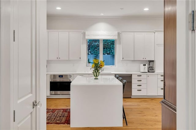 225 Ridgewood Dr, Metairie, LA 70005 - kitchen featuring white cabinetry, light countertops, and appliances with stainless steel finishes