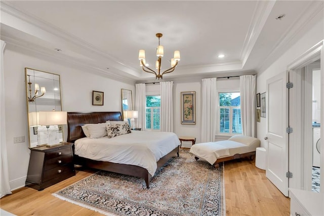 225 Ridgewood Dr, Metairie, LA 70005 - bedroom featuring a raised ceiling, light wood finished floors, a notable chandelier, and ornamental molding