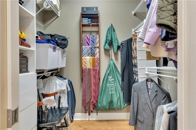 225 Ridgewood Dr, Metairie, LA 70005 - walk in closet featuring wood finished floors