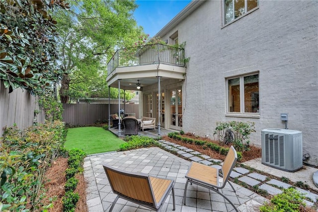 225 Ridgewood Dr, Metairie, LA 70005 - back of house with central air condition unit, a ceiling fan, a fenced backyard, a patio, and a balcony