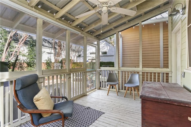 sunroom with a wealth of natural light and a ceiling fan