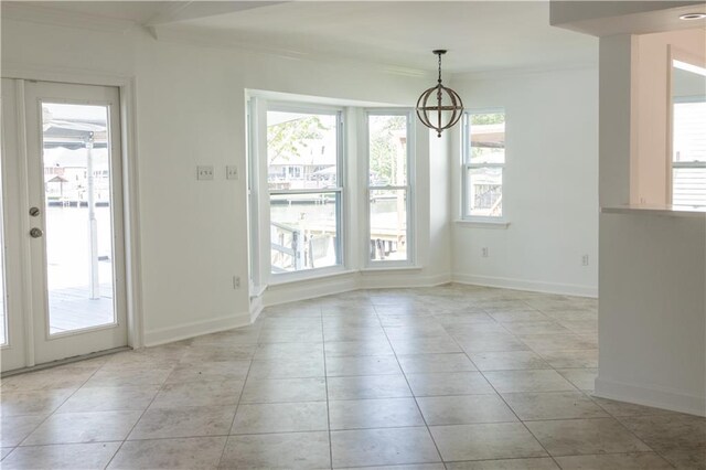 272 Marina Dr, Slidell, LA 70458 - unfurnished dining area with baseboards, ornamental molding, light tile patterned flooring, and a chandelier