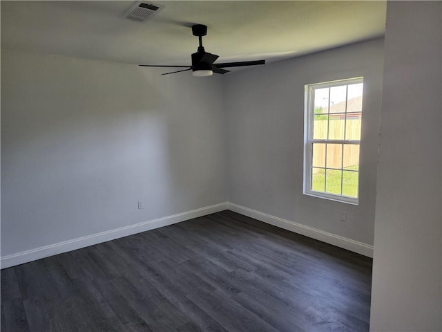 2405 Tattersall Dr, Harvey, LA 70058 - unfurnished room featuring dark wood-type flooring, visible vents, baseboards, and a ceiling fan