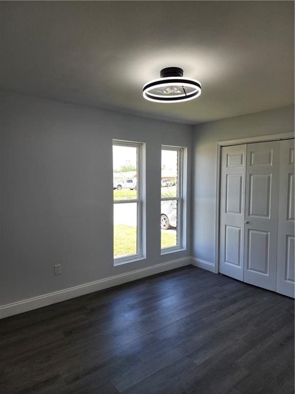 2405 Tattersall Dr, Harvey, LA 70058 - interior space with dark wood-type flooring, a closet, and baseboards