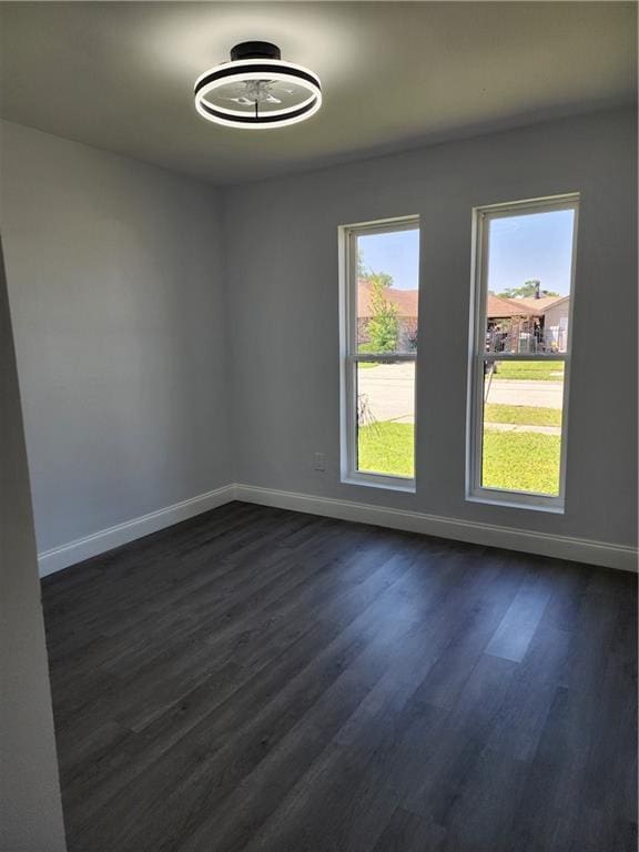 2405 Tattersall Dr, Harvey, LA 70058 - spare room with dark wood-style flooring and baseboards