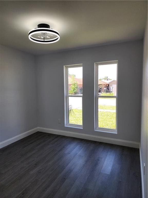 2405 Tattersall Dr, Harvey, LA 70058 - unfurnished room featuring baseboards and dark wood finished floors