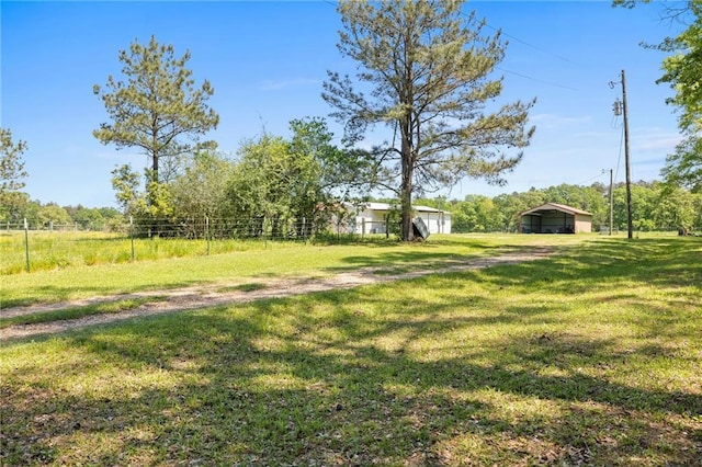 1510 Pumping Station Rd, Greensburg, LA 70441 - view of yard with a detached carport and an outdoor structure