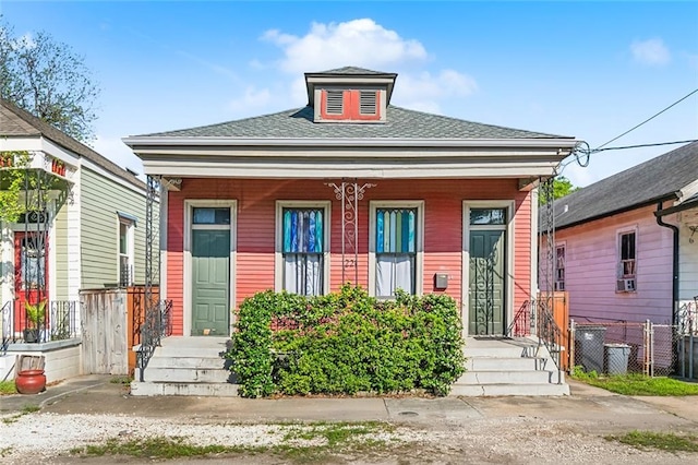 1221 Independence St, New Orleans, LA 70117 - view of front of property with fence and a shingled roof