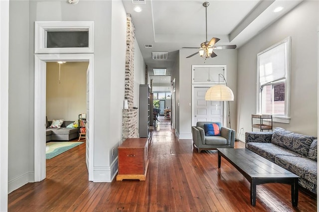1221 Independence St, New Orleans, LA 70117 - living area featuring wood-type flooring, baseboards, and ceiling fan