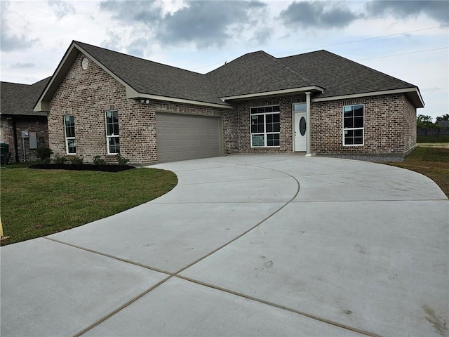719 Rue St, Michael, Terrytown, LA 70056 - view of front of property featuring a shingled roof, brick siding, driveway, an attached garage, and a front lawn