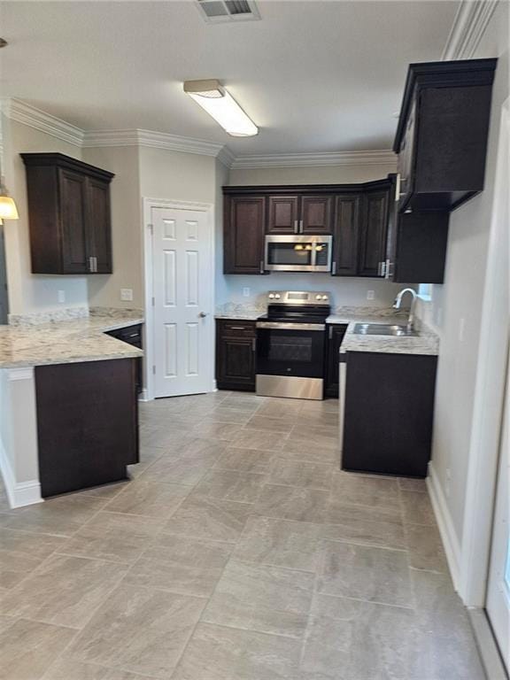 719 Rue St, Michael, Terrytown, LA 70056 - kitchen with stainless steel appliances, ornamental molding, dark brown cabinetry, and a peninsula
