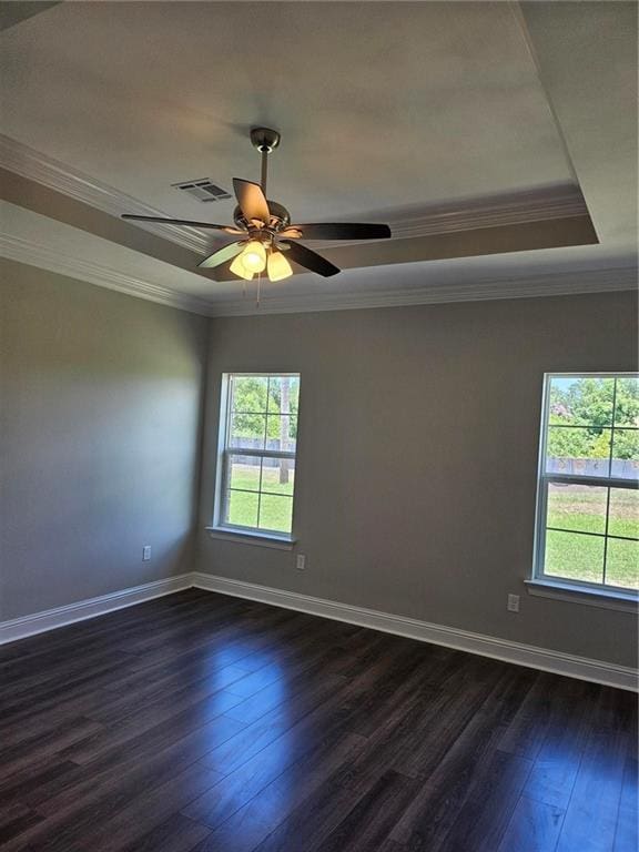 719 Rue St, Michael, Terrytown, LA 70056 - spare room featuring plenty of natural light, crown molding, a raised ceiling, dark wood finished floors, and ceiling fan