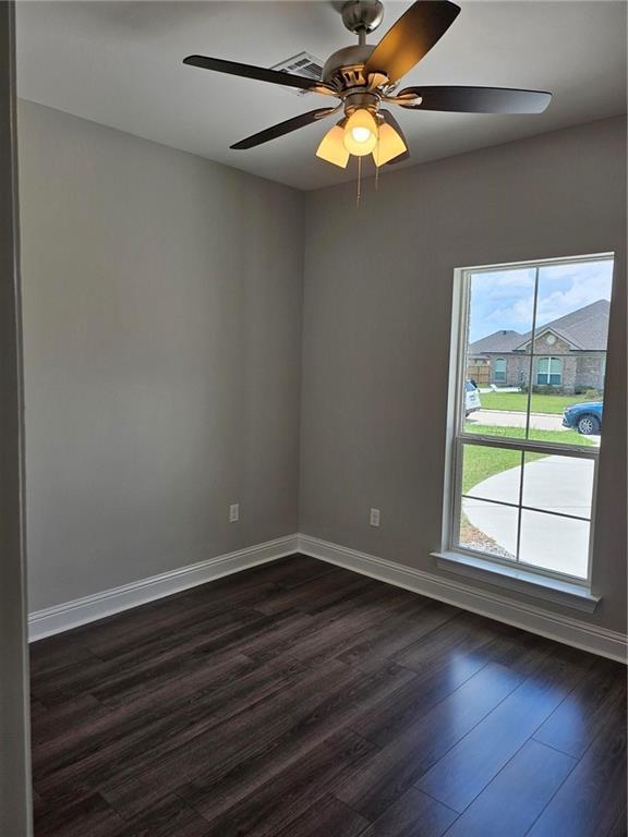 719 Rue St, Michael, Terrytown, LA 70056 - unfurnished room featuring dark wood-style floors and ceiling fan