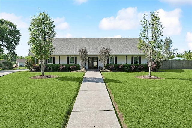 313 Sarah Victoria Dr, Belle Chasse, LA 70037 - single story home featuring a front yard, roof with shingles, and fence