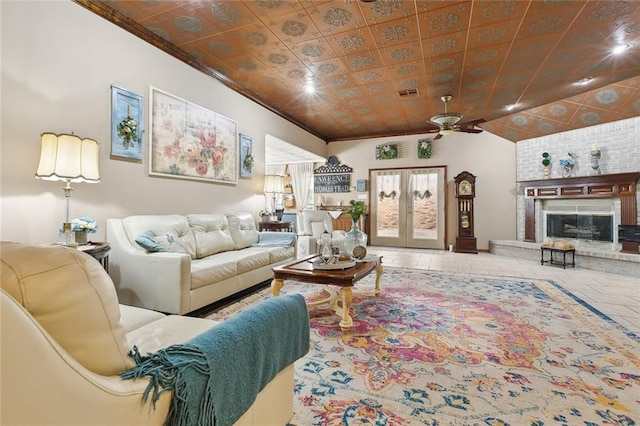 313 Sarah Victoria Dr, Belle Chasse, LA 70037 - living area with a fireplace, ornamental molding, a ceiling fan, visible vents, and french doors