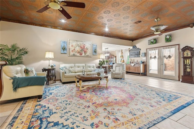 313 Sarah Victoria Dr, Belle Chasse, LA 70037 - living room with visible vents, ceiling fan, tile patterned flooring, and an ornate ceiling