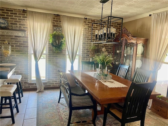 313 Sarah Victoria Dr, Belle Chasse, LA 70037 - dining space featuring an ornate ceiling, ornamental molding, and brick wall