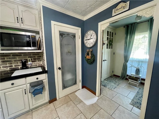 313 Sarah Victoria Dr, Belle Chasse, LA 70037 - interior space with a shower stall, tile patterned flooring, an ornate ceiling, and baseboards