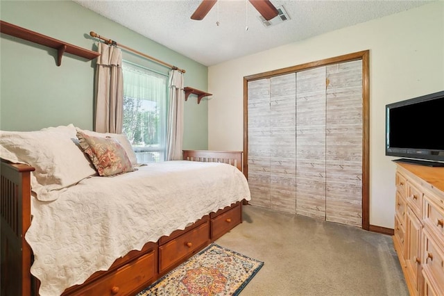 313 Sarah Victoria Dr, Belle Chasse, LA 70037 - bedroom with visible vents, a ceiling fan, carpet floors, and a textured ceiling