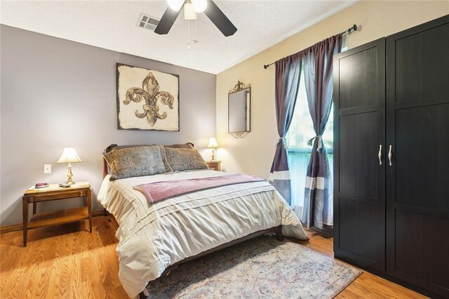 313 Sarah Victoria Dr, Belle Chasse, LA 70037 - bedroom featuring visible vents, ceiling fan, and light wood-type flooring