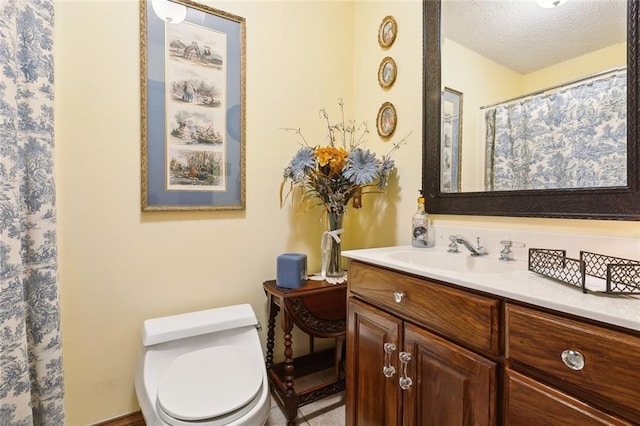 313 Sarah Victoria Dr, Belle Chasse, LA 70037 - bathroom featuring vanity, a textured ceiling, and toilet