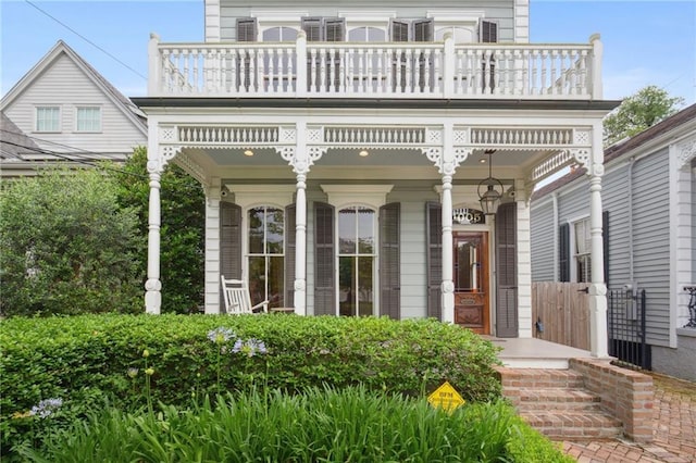 view of front facade featuring a balcony and a porch