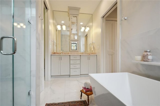 bathroom with marble look tile flooring, a freestanding tub, double vanity, and a stall shower