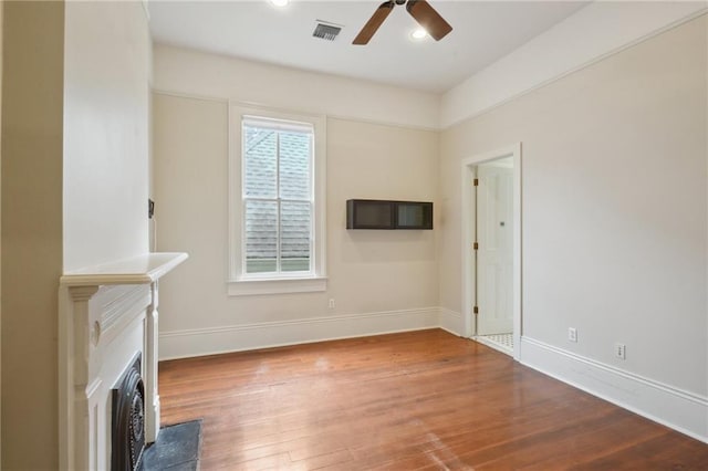 unfurnished living room featuring ceiling fan, wood finished floors, baseboards, and recessed lighting