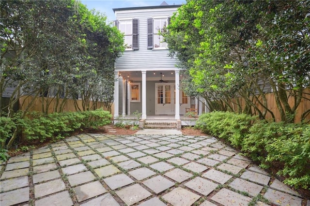 rear view of property featuring french doors and a patio