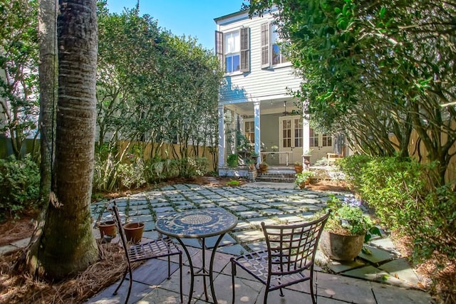view of patio featuring fence