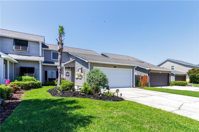 1612 Marina Dr, Slidell, LA 70458 - view of front facade with a garage, a front yard, and driveway