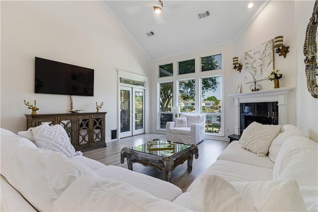 1612 Marina Dr, Slidell, LA 70458 - living area featuring crown molding, high vaulted ceiling, ceiling fan, and visible vents