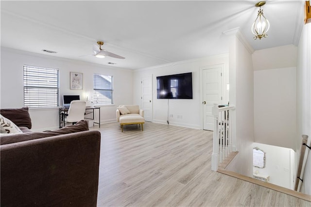 1612 Marina Dr, Slidell, LA 70458 - living room with crown molding, wood finished floors, a ceiling fan, and visible vents