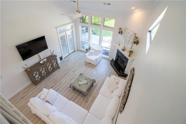 1612 Marina Dr, Slidell, LA 70458 - living room with crown molding, visible vents, ceiling fan, and wood finished floors