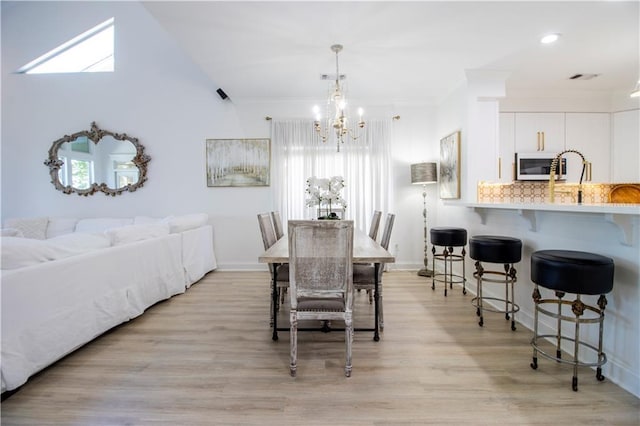 1612 Marina Dr, Slidell, LA 70458 - dining room with a chandelier, light wood-type flooring, crown molding, and visible vents