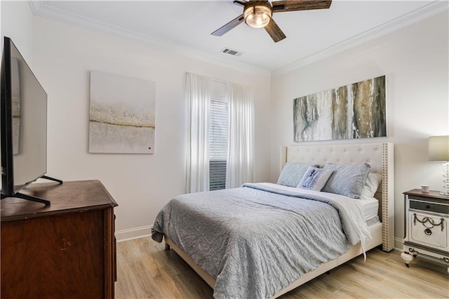 1612 Marina Dr, Slidell, LA 70458 - bedroom featuring baseboards, ornamental molding, light wood-style floors, visible vents, and ceiling fan