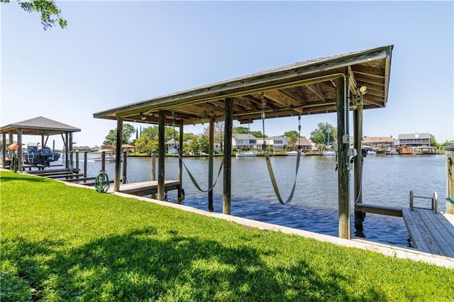 1612 Marina Dr, Slidell, LA 70458 - dock area featuring a water view, boat lift, and a lawn