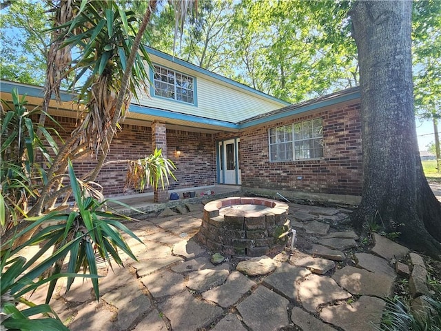 view of patio / terrace featuring a fire pit