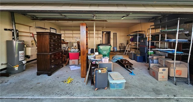 garage with a sink and water heater
