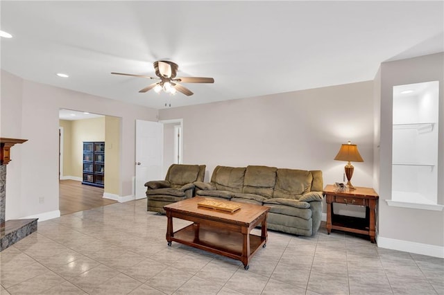 5245 Sanford St, Metairie, LA 70006 - living area with a ceiling fan, baseboards, recessed lighting, light tile patterned floors, and a fireplace