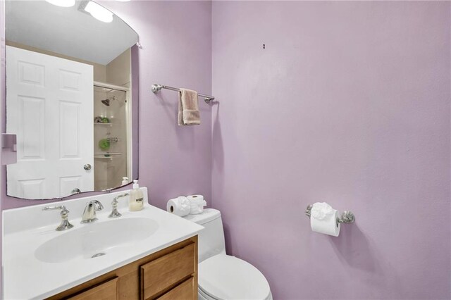 5245 Sanford St, Metairie, LA 70006 - full bathroom featuring toilet, an enclosed shower, and vanity