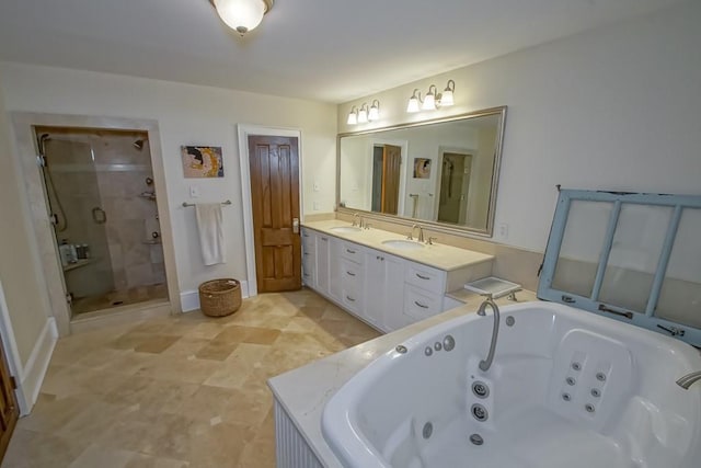 full bathroom with a stall shower, double vanity, a sink, and a whirlpool tub