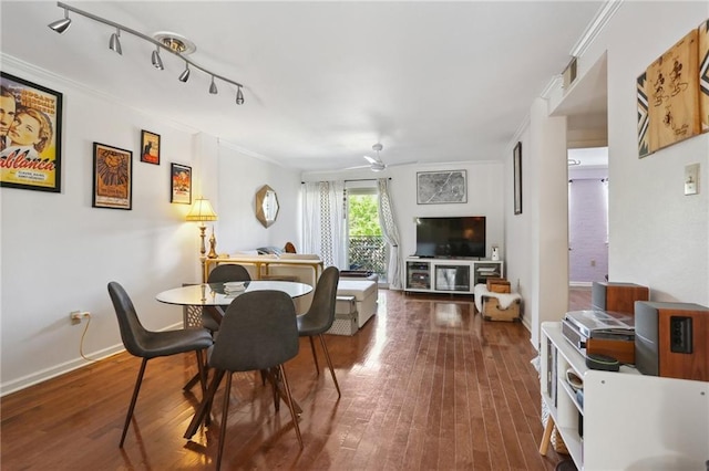 3915 St Charles Ave Unit 215, New Orleans, LA 70118 - dining space featuring a ceiling fan, ornamental molding, wood finished floors, rail lighting, and baseboards