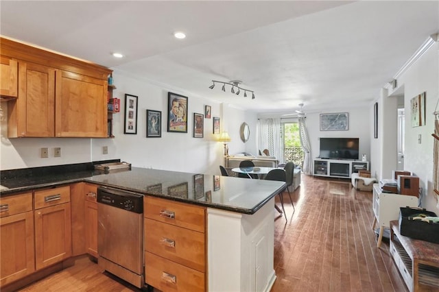 3915 St Charles Ave Unit 215, New Orleans, LA 70118 - kitchen with dishwasher, a peninsula, open floor plan, brown cabinets, and crown molding