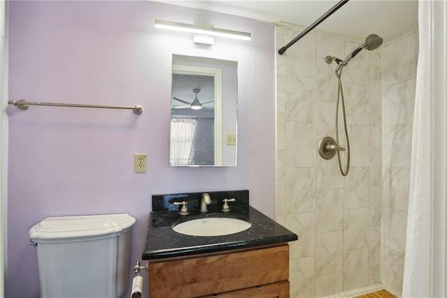 3915 St Charles Ave Unit 215, New Orleans, LA 70118 - bathroom featuring vanity, tiled shower, toilet, and a ceiling fan