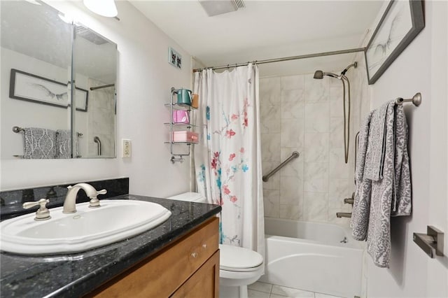 3915 St Charles Ave Unit 215, New Orleans, LA 70118 - full bathroom featuring toilet, shower / bath combo with shower curtain, vanity, and tile patterned floors